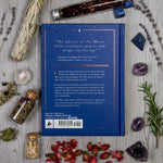 Book back cover with text and decorative elements on a wooden surface