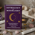 Book cover of 'Astrology by Moonlight' with celestial design on a purple background