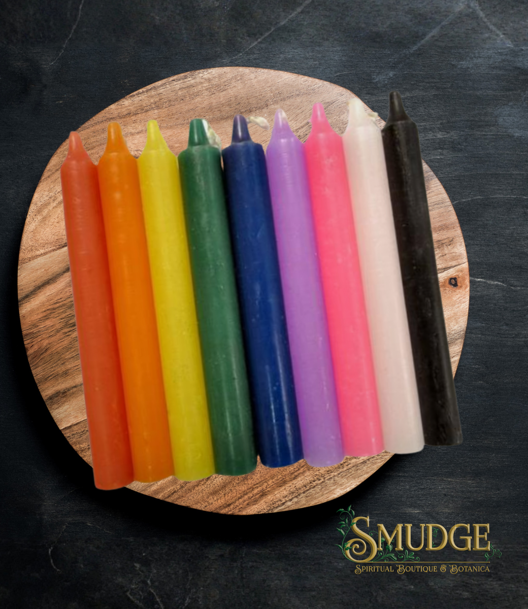 Set of colorful candles on a wooden board with 'Smudge' branding.