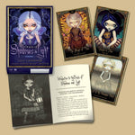 Card game set with character cards and a box titled 'Oracle of Shadows & Light' on a beige background.