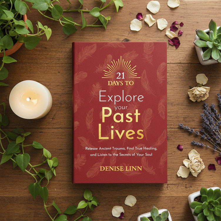 Book cover of '21 Days to Explore Your Past Lives' by Denise Linn on a red background with feather designs.