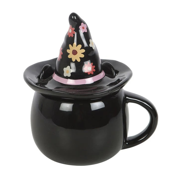 Black mug with a decorative witch hat on a white background