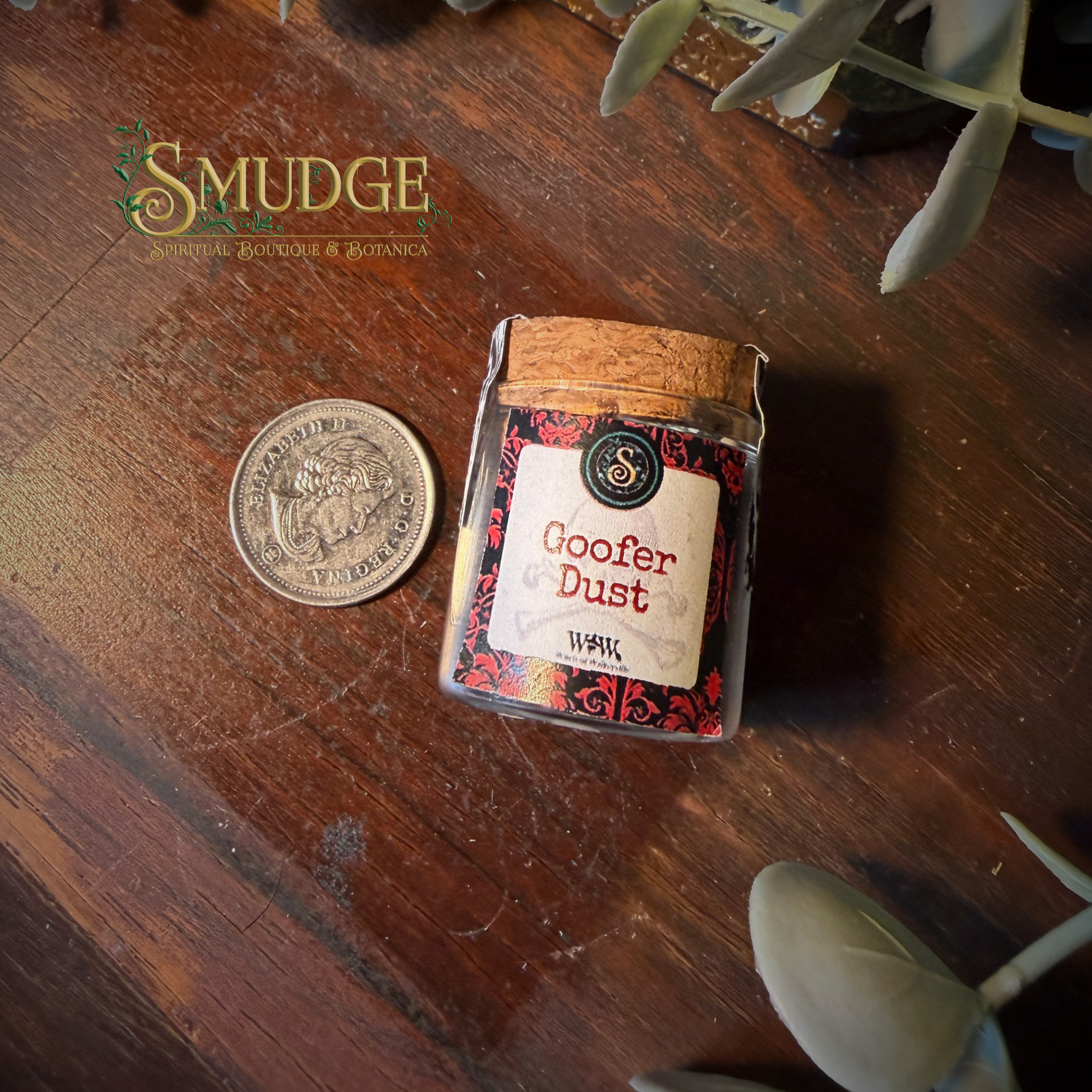 Jar of 'Goofer Dust' on a wooden surface with 'Smudge' branding.
