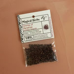 Packaged herbs with a label on a textured surface