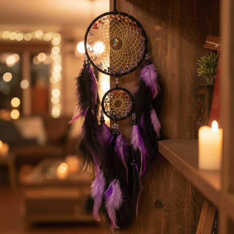 Decorative fan with purple and black feathers on a reflective surface