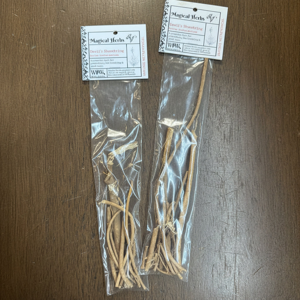 Herbal roots in a clear plastic bag with labels on a wooden surface