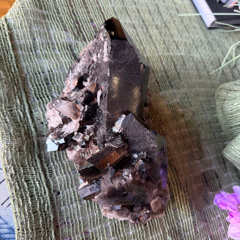 Mineral specimen on a textured surface with a blurred background