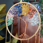Decorative wall hanging with colored stones and gold chain
