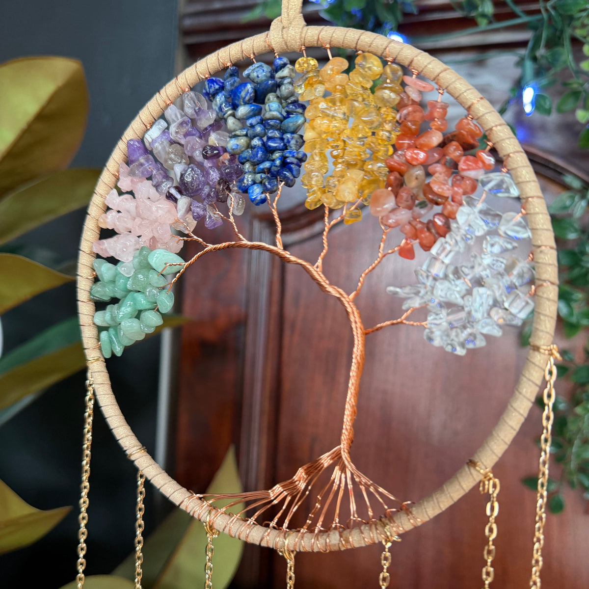 Decorative wall hanging with colored stones and gold chain