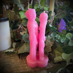 Pink people candle  on a plant background