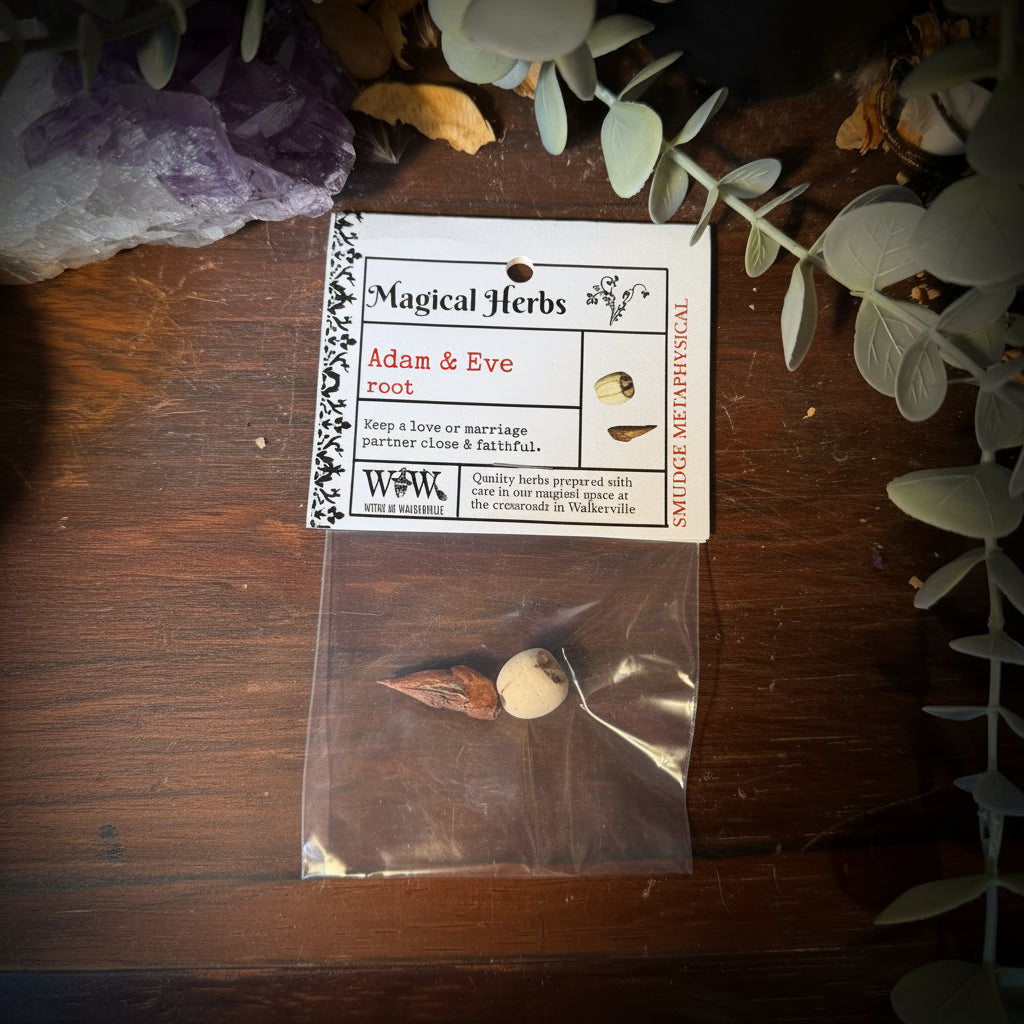 Herbal product packaging with label Adam & Eve root on a wooden surface surrounded by plants and crystals.