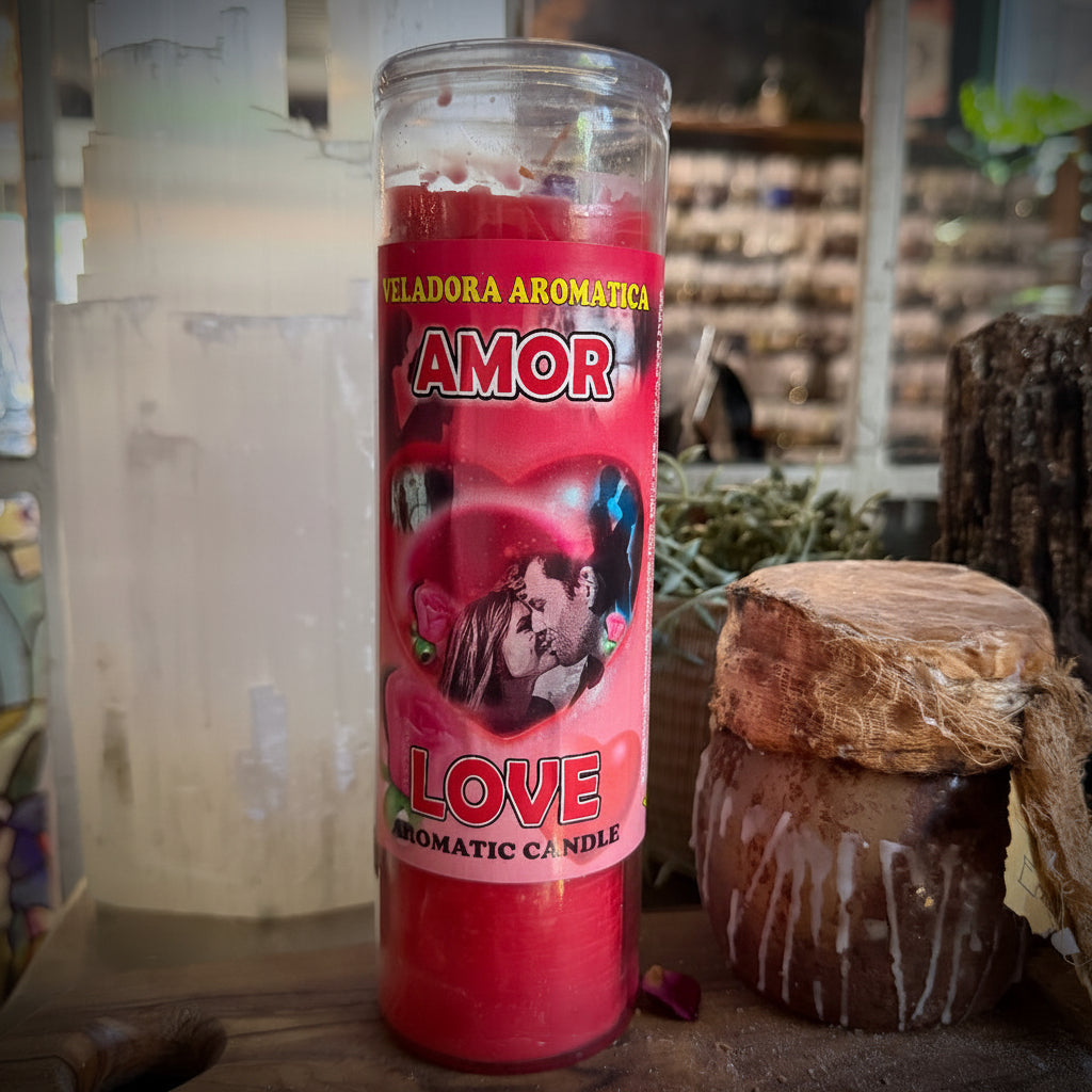 Candle labeled 'Amor' with a red label on a rustic background