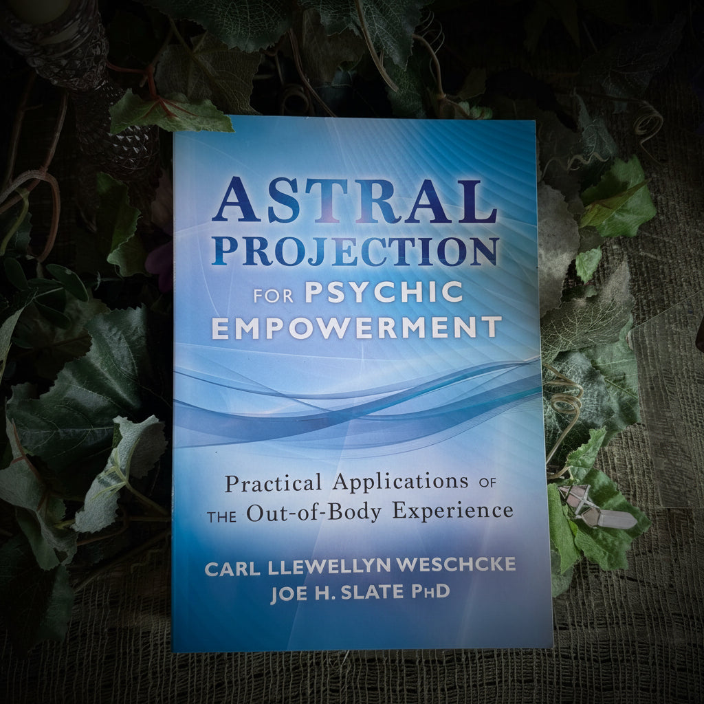 Book titled 'Astral Projection for Psychic Empowerment' on a table with greenery