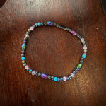 Multicolored beaded bracelet on a wooden surface