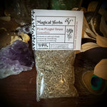 Packaged herbs with a label on a wooden surface with decorative elements
