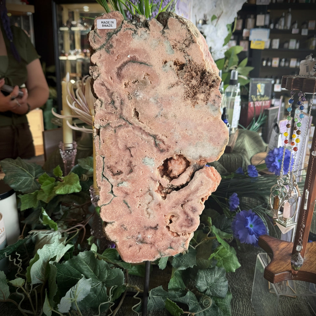 Decorative stone with greenery and flowers on a table