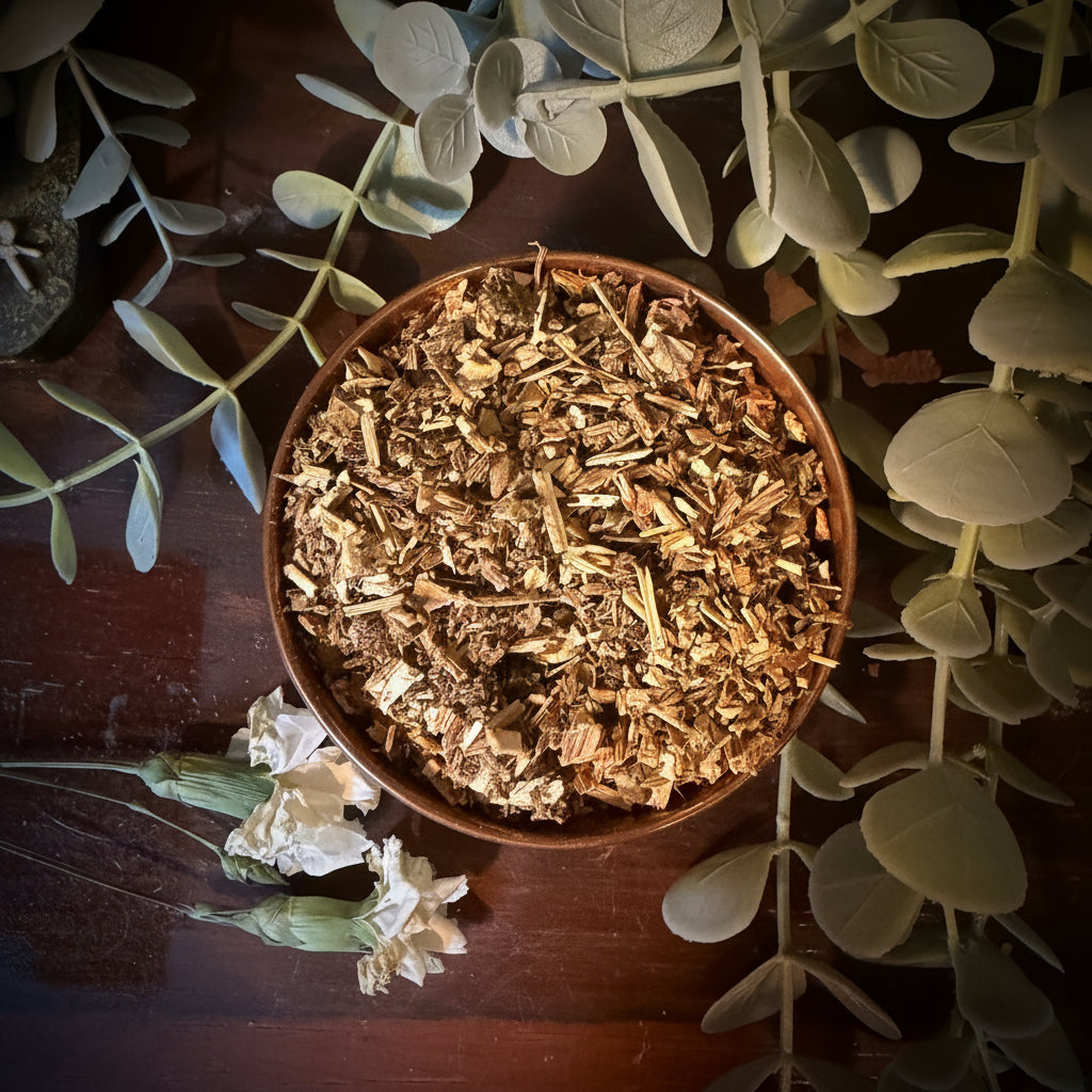 Bowl of dried motherwort herbs on a wooden surface with green leaves