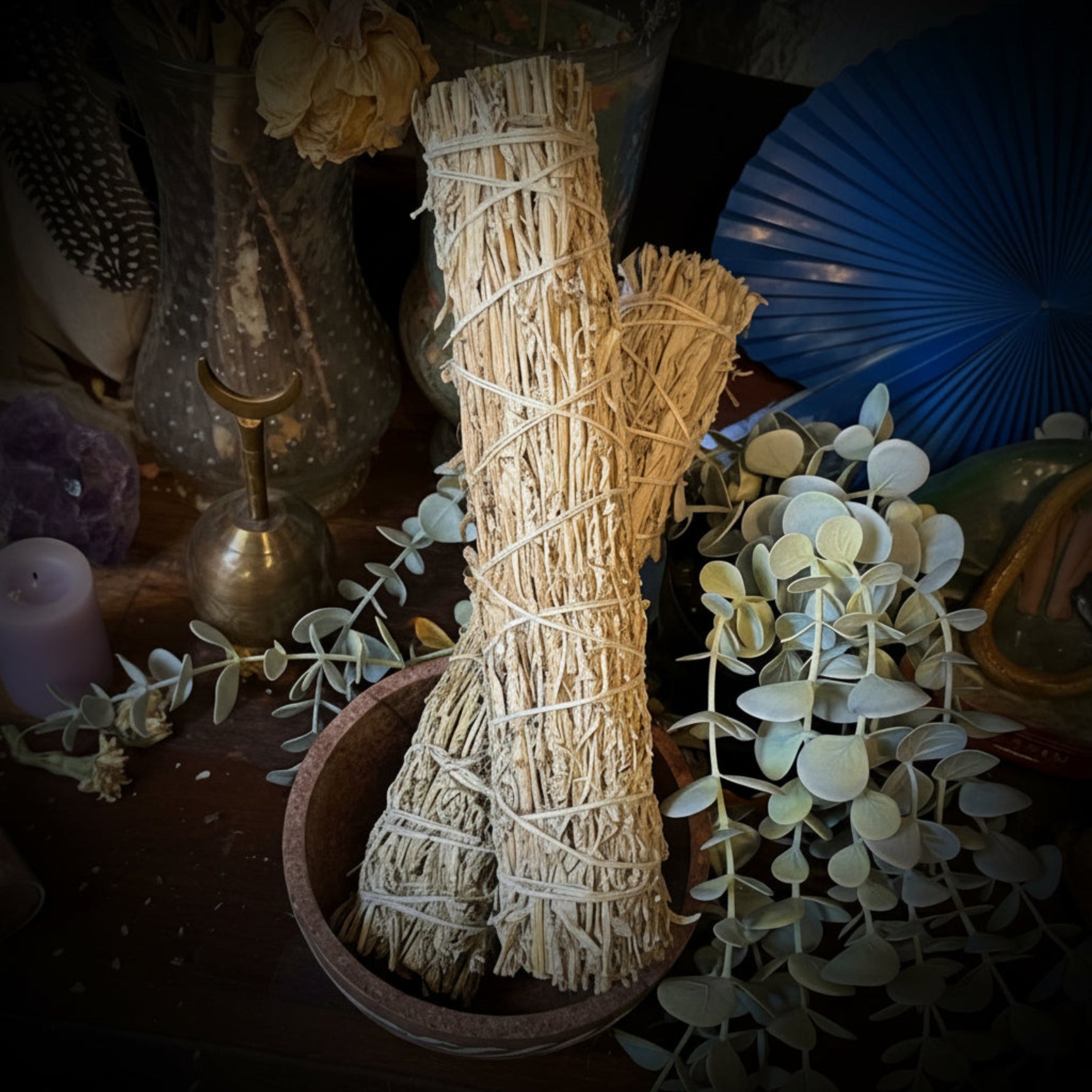 mugwort herb bundle, sage stick in a bowl.