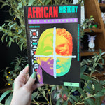 African History For Beginners Book Held Up With a Herbal Background