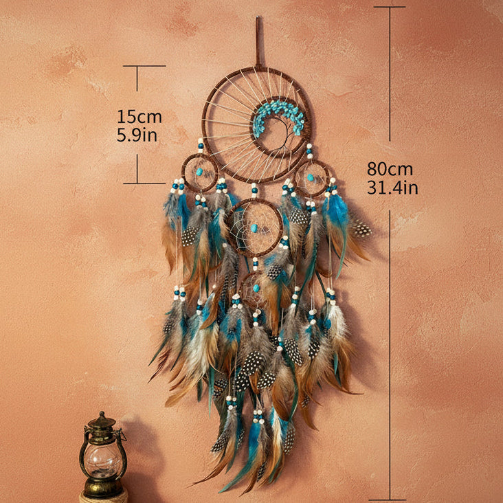 Dreamcatcher with feathers and measurements on a plain background