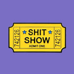 Ticket-shaped pin with 'SHIT SHOW' text on a denim background