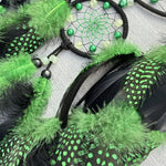 Green and black feathered product with a dreamcatcher design on a white background.