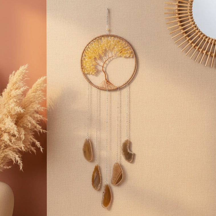 Decorative wall hanging with stones and lights on a white wall