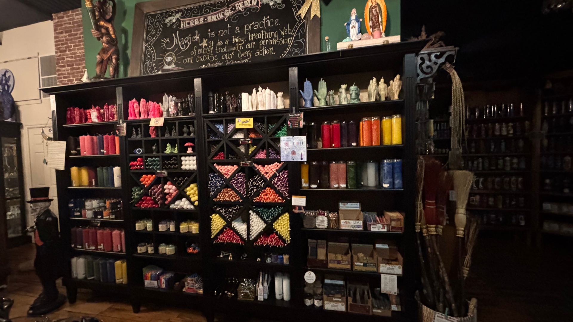 Display of various bottles and containers on shelves in a store setting.