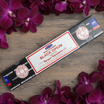 Nivinag Black Opium incense stick packaging on a white floral background