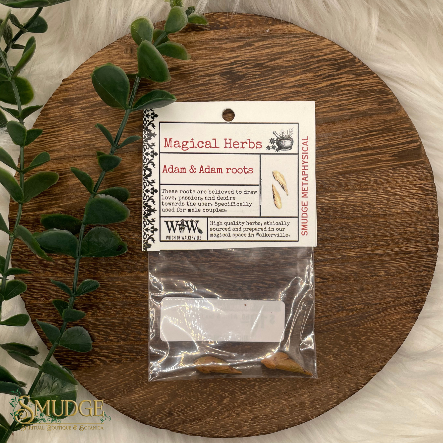 Packaged herbs on a wooden board with a label, surrounded by greenery.