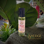 Roll-on bottle of 'Citrus Bliss' perfume with green leaves and plants in the background, featuring the brand 'Smudge'.