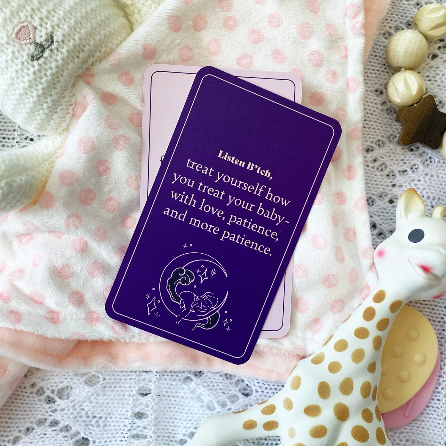 Inspirational card on a baby blanket. The card says "treat yourself how you treat your baby - with love & patience"