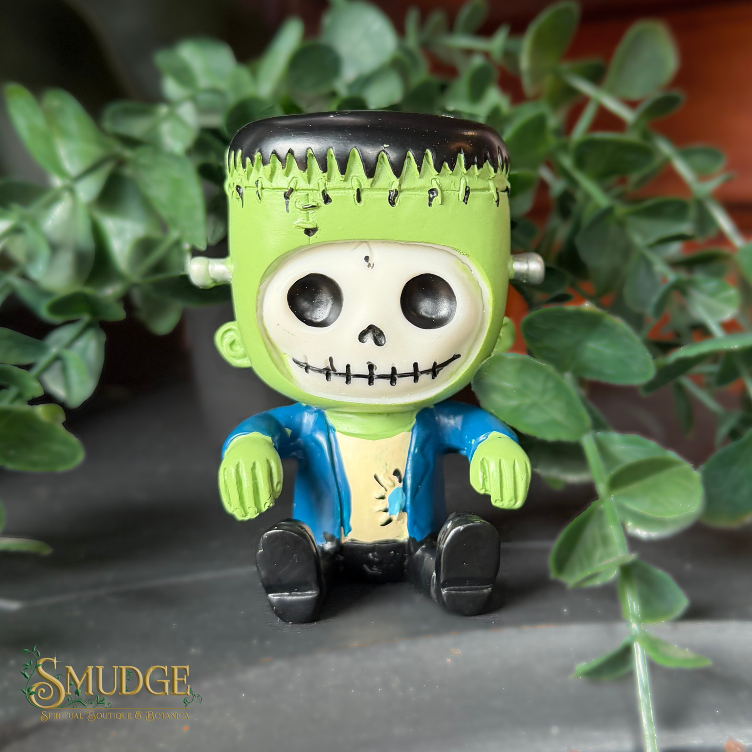 Frankinstein figurine on a leafy background with Smudge logo
