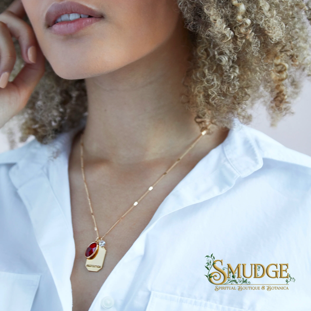 Pendant necklace from Foxy Jewelry on a woman's neck.
