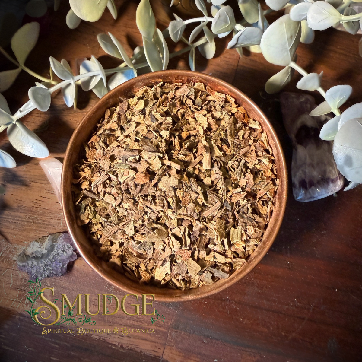 a bowl of loose lobelia leaf herb on a wooden table
