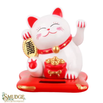 White cat figurine with red accents and gold details on a white background, featuring the brand 'Smudge'.
