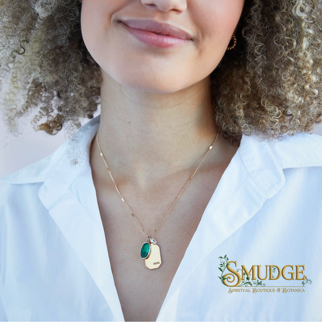 woman wearing birthstone necklace with Smudge logo on bottom right of picture