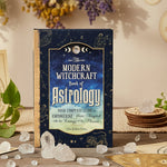Book titled 'Modern Witchcraft Book of Astrology' on a gradient background