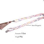 Necklace with pastel beads and a tassel on a white background