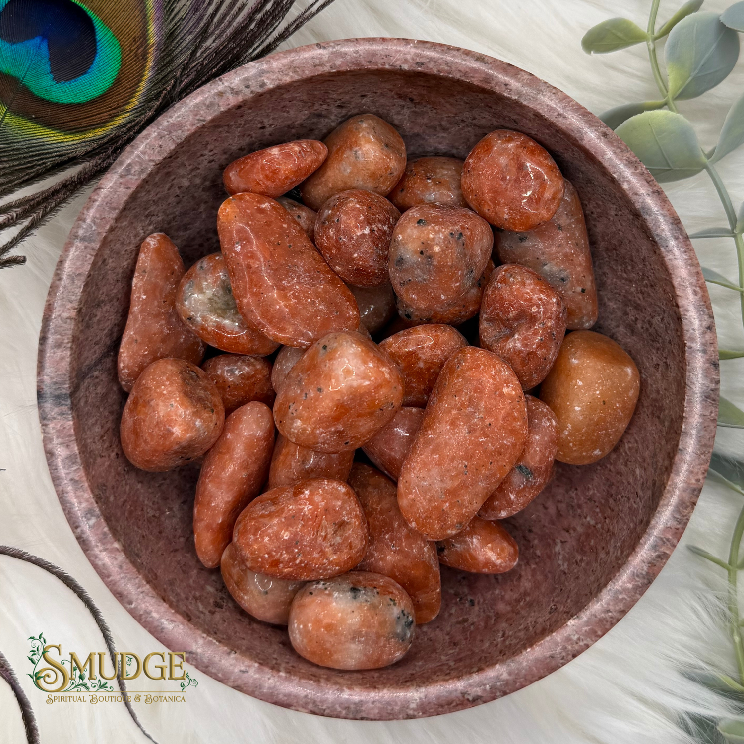 Orange stones in bowl with Smudge logo