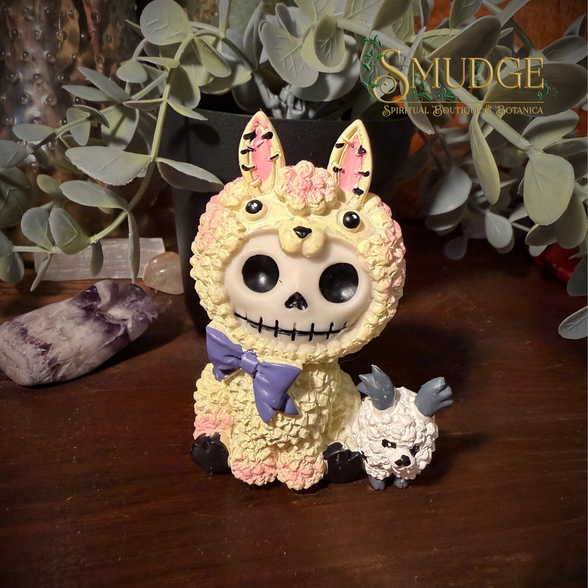 Paco furrybones figurine of a little ghost face in a lama costume with a baby sheep by his feet.