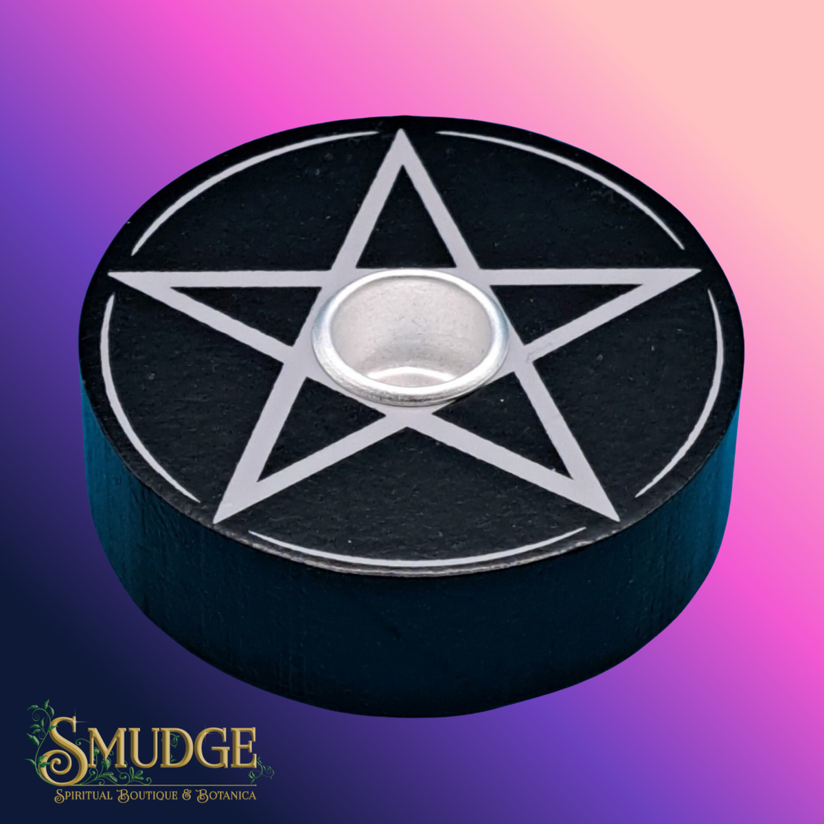 Black candle holder with silver pentagram design on a gradient purple and pink background, featuring the brand 'Smudge'.