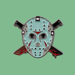 Pin with a light blue hockey mask design on a denim background