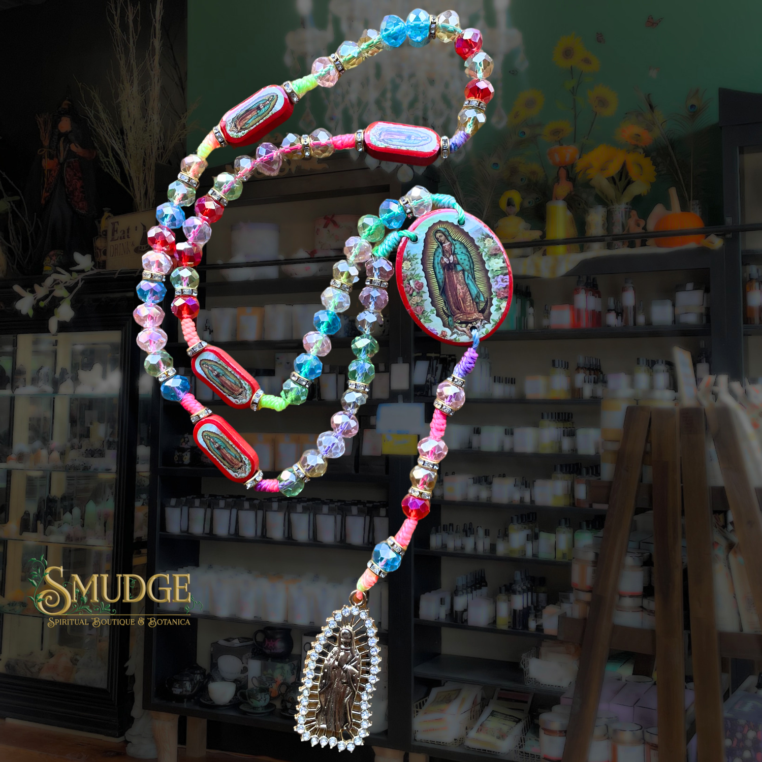 Colorful beaded necklace with religious symbols in a store setting