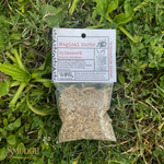 Bag of Spikenard herbs with a label on grass