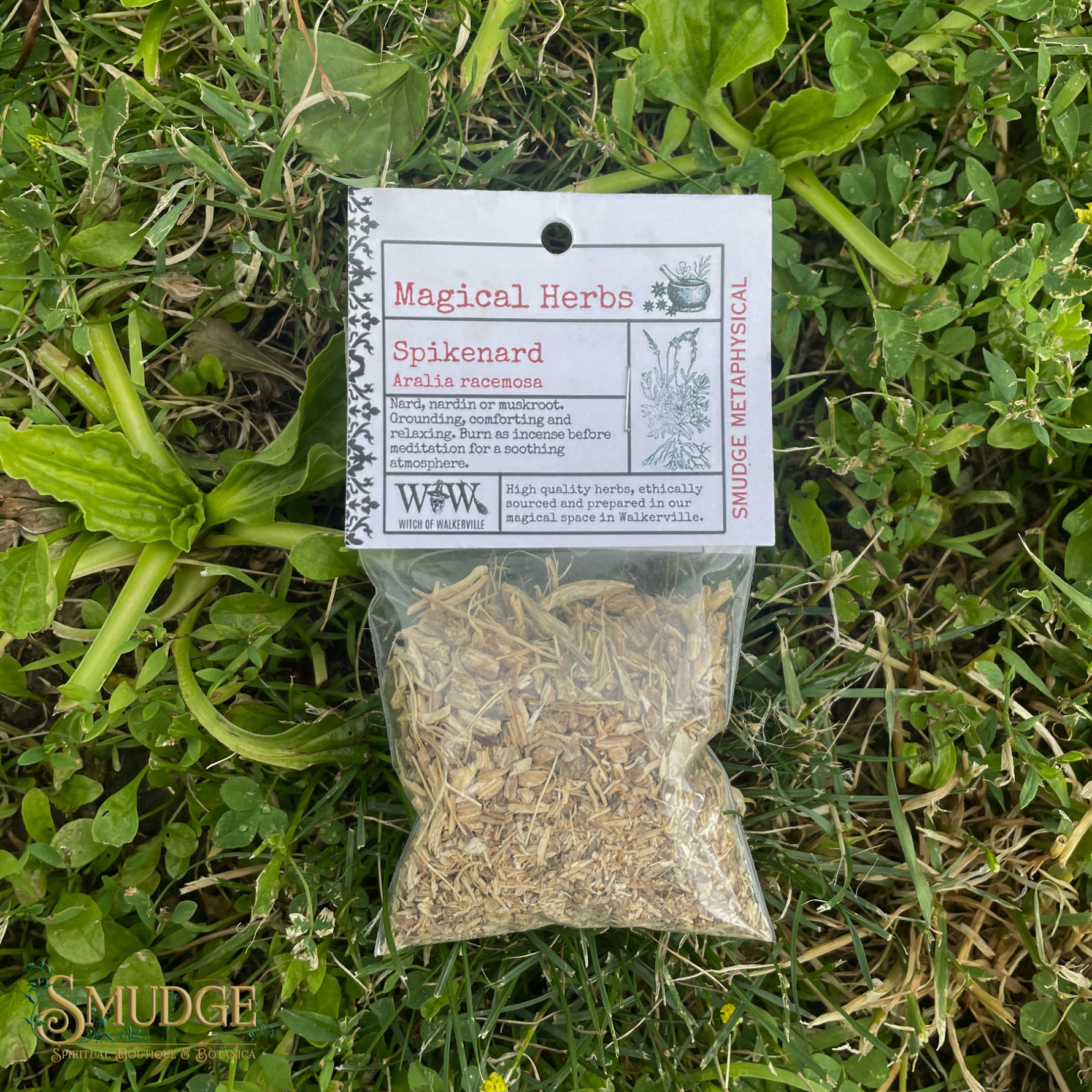Bag of Spikenard herbs with a label on grass