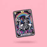 A small rectangular enamel pin featuring a tarot-style skeleton riding a unicorn with a rainbow, roses, and stars,  against a pink background.